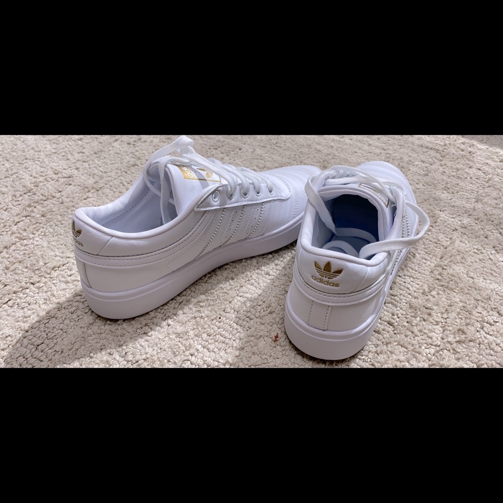 Brand new adidas ladies white sneakers.